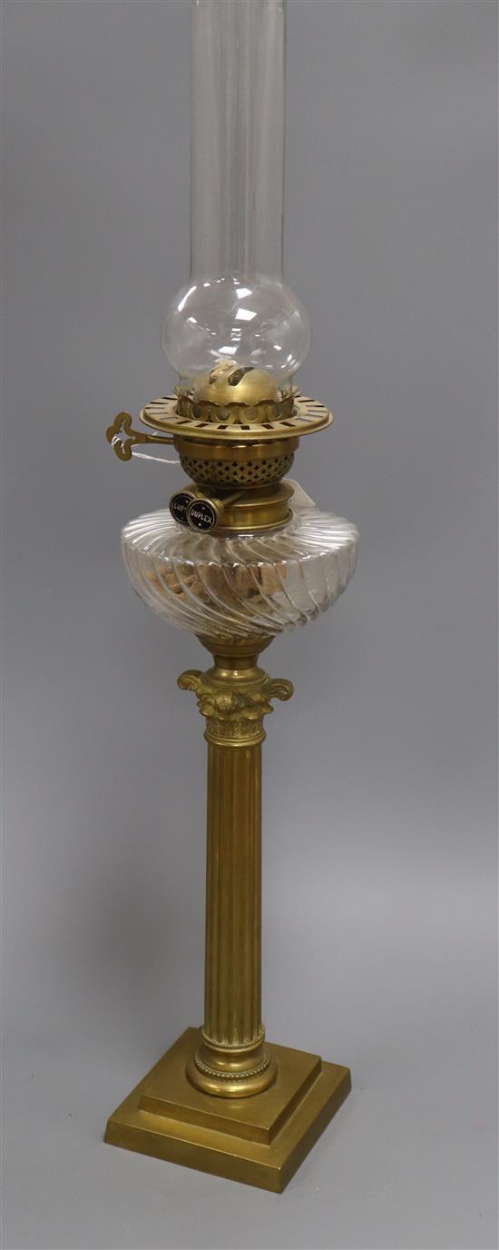 A brass Corinthian column oil lamp